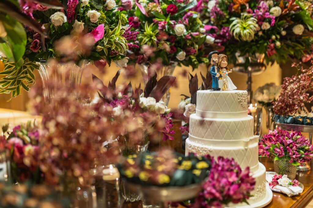 wedding cake and flowers on table